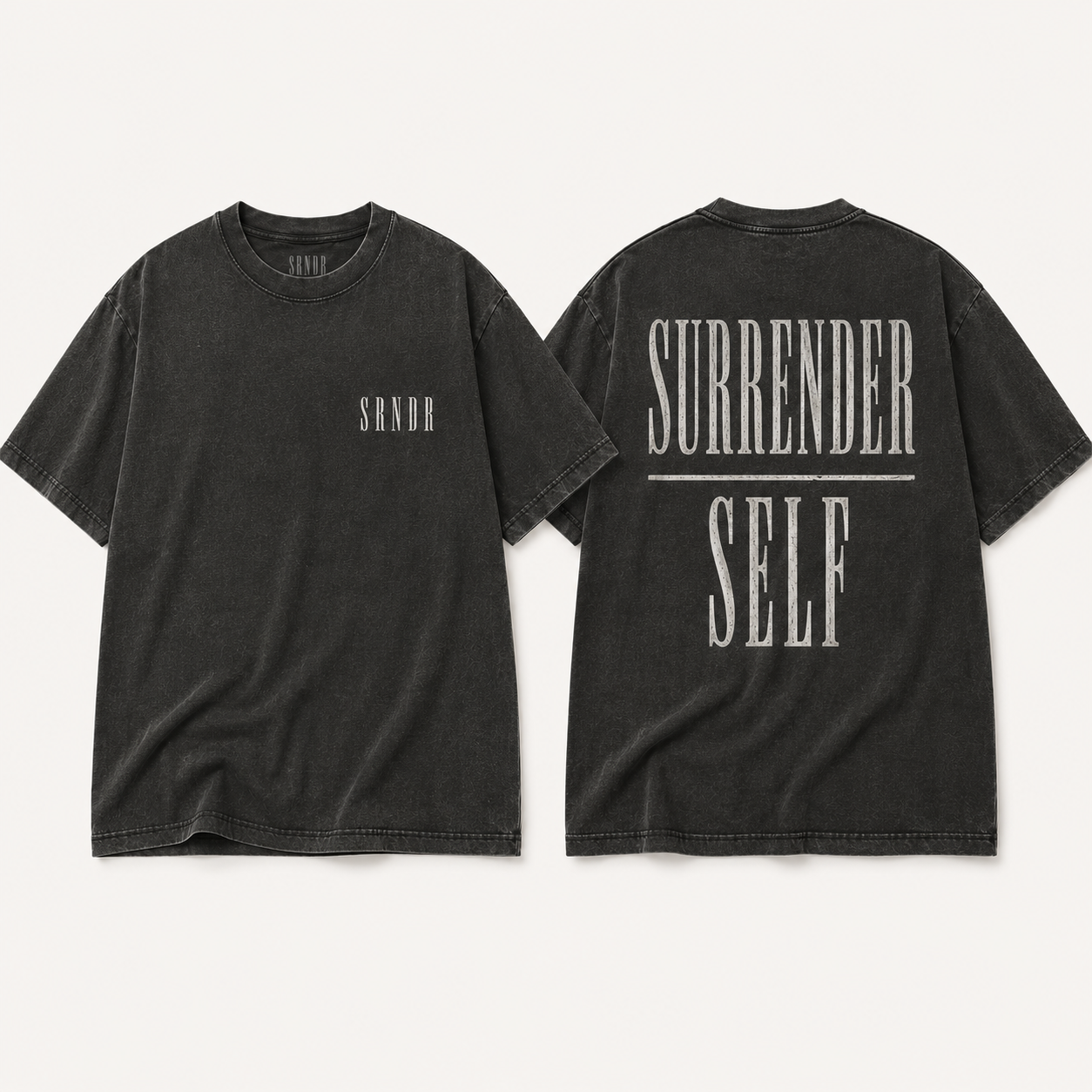 Two views of a washed black t-shirt on a light beige background. The front view shows a small white 'SANDR' logo on the left chest, and the back view features a large distressed white graphic reading 'SURRENDER SELF' with a horizontal line.